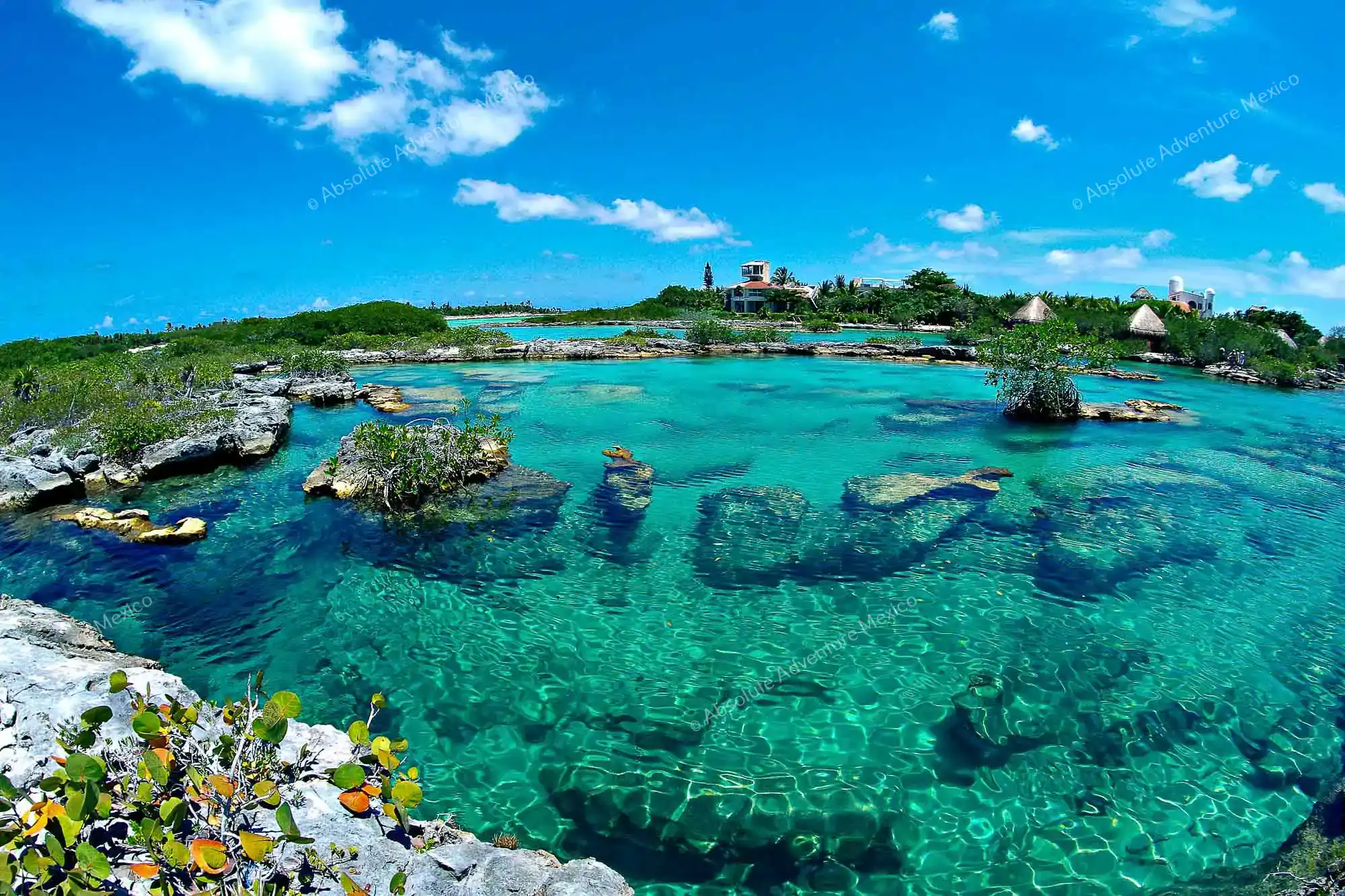 Calm lagoon water and rocky snorkeling coves at Yal-Kú Lagoon in Akumal
